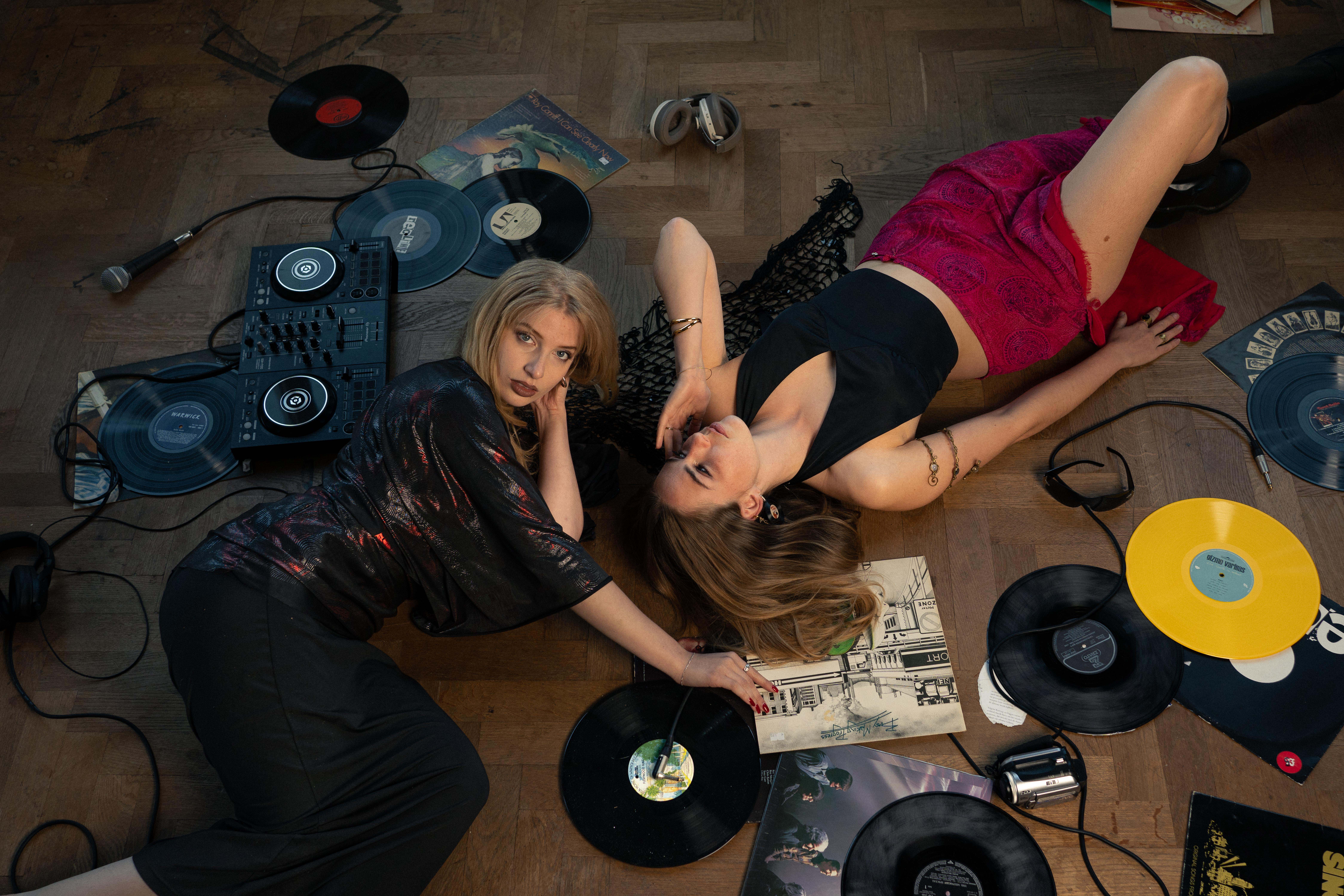 Amaris and Niki mid-session, vinyl and gear scattered around them